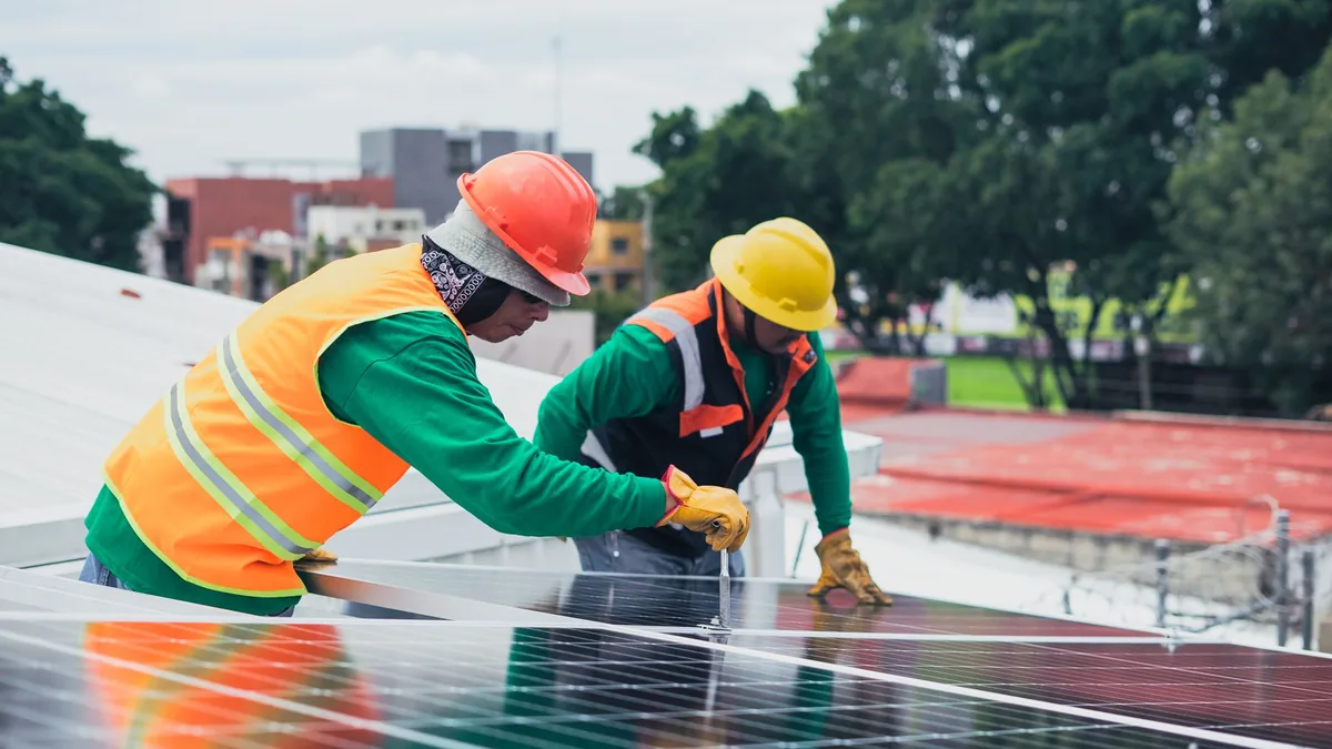 Solar installation crew working on a residential roof in Winston-Salem, NC
