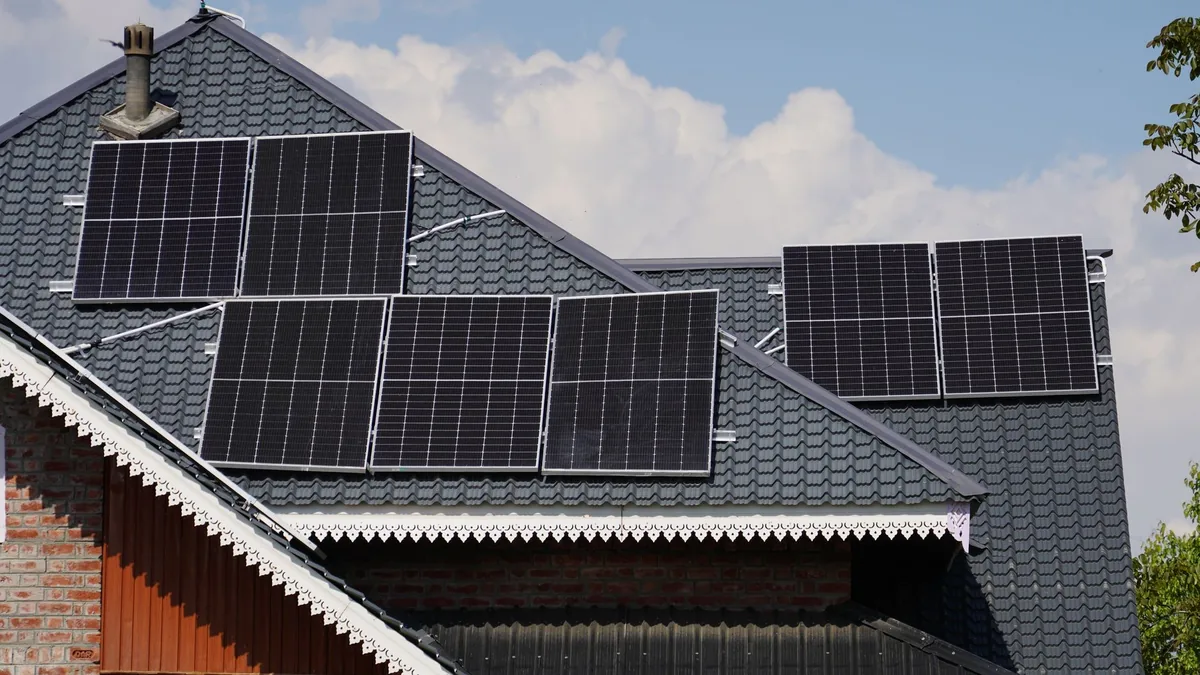 Solar installers on a home roof in Winston-Salem, NC